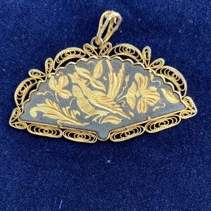 Elegant Gold and Black Filigree Pendant